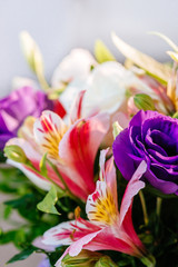 Stylish colorful floral bridal bouquet with roses. Designer fresh flower bouquet from a florist. Beautiful blossoming flower wedding designer bouquet. Close up view