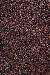 Fresh brown coffee beans texture of roasted ready to drink close-up.