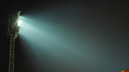 The stadium lights turned on at night