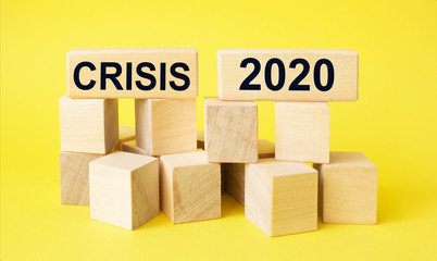 Obraz premium 2020 concept. Government economy improvings. Wooden blocks with coins, dollar, graphs laying on real money, panorama, copy space