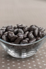 dried cranberries in chocolate in a glass bowl
