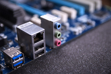Computer motherboard and electronical components cpu gpu memory and different sockets for video...