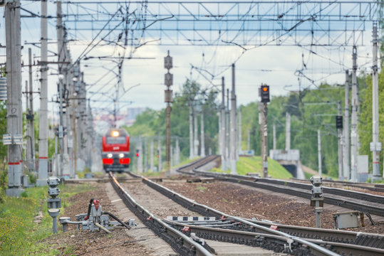 Blurred image of the passenger train approaches to the station.