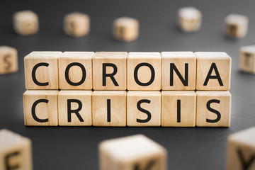 Corona crisis - word from wooden blocks with letters, coronavirus pandemic crisis concept, random...