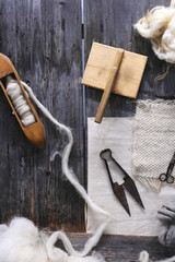 Wooden weaving shuttle on an old manual weaving machine