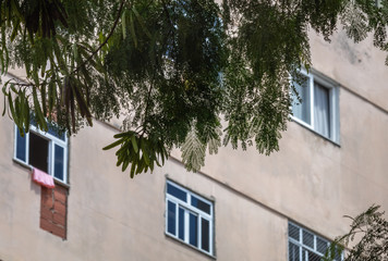 Windows in the facade detail of a house in an urban area of Rio de Janeiro.