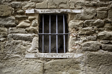 Fototapeta na wymiar Window with rust bars