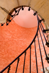 Under antique spiral staircase