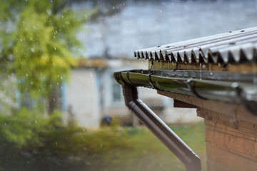 rain flows down from the roof