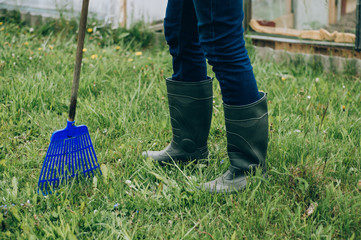 work on a personal plot, boots and rake work equipment