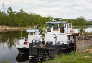 Pair of river tow ships at the pier.
