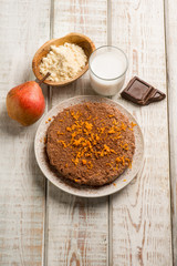 chocolate cake with pear milk and orange grated peel
