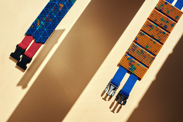 The blue and orange massage belt lie on the orange surface. abstraction and shadows. Advertising,...