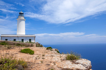 Fototapeta na wymiar Formentera lighthouse against the blue sky