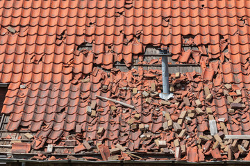 major storm damage to a tiled roof, Ceramic roof tiles