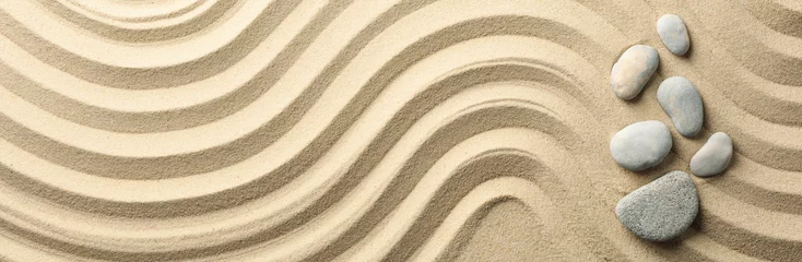 Selbstklebende Fototapeten Zen Steine Stones on the sand with patterns. Zen concept  © Atlas