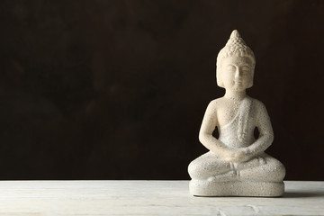 Buddha on white wooden table. Zen concept