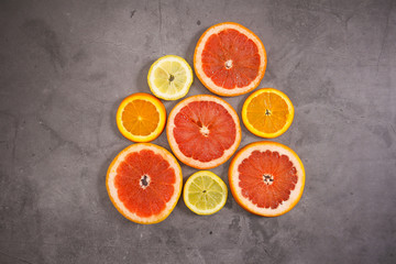 Slices of citrus fruits on the table 