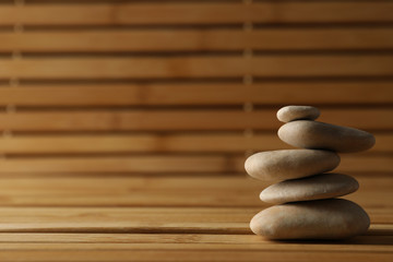 Fototapeta na wymiar Stones on the bamboo background. Zen concept