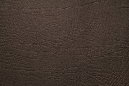 Black elaphant print leather texture background, genuine leather. Top view 