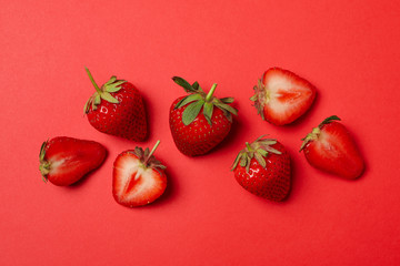 Tasty strawberry on red background. Summer berry