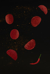 red chips that fly on a black background