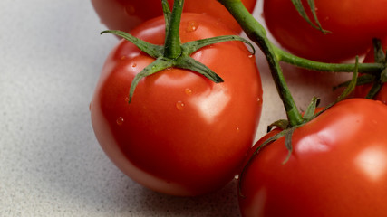 Fresh tomatoes on a kithen's table