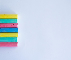 crayons of different colors on a white sheet of paper.