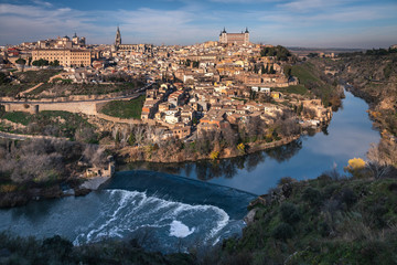 Fototapeta na wymiar Cityscape of the monumental city of Toledo with the view of the old town and the Tajo river at the foot of the city, Spain.