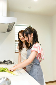 A mother and girl in the kitchen