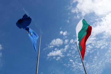 EU and Bulgaria flags waving in the wind against sky