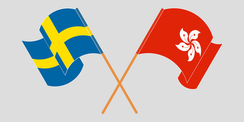 Crossed and waving flags of Hong Kong and Sweden