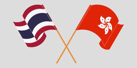 Crossed and waving flags of Hong Kong and Thailand