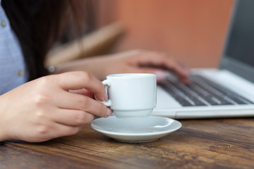 woman hand coffee and computer in street cafe