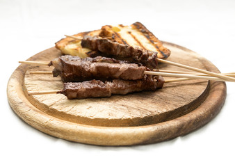 Arrosticini and bruschetta bread: typical Abruzzese dish
