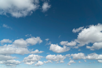 Light clouds in the blue sky during the day.