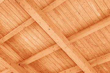 The construction of the wooden roof. Detailed photo of a wooden roof overlap construction.