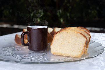 Slices of cake and a cup of coffee on a plate on a table