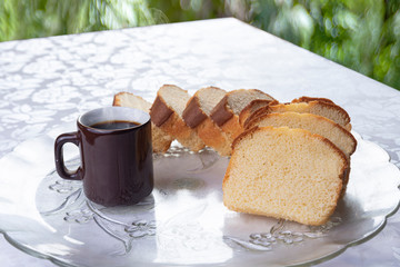 Slices of cake and a cup of coffee on a plate on a table