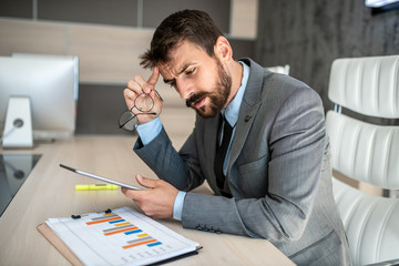 Businessman worried about bad business company decisions