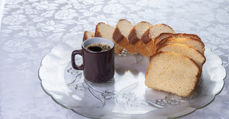 Slices of cake and a cup of coffee on a plate on a table