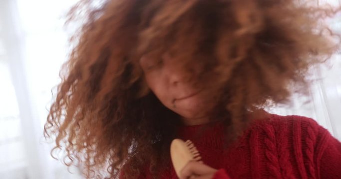 Close Up Of Black Woman Singing Into Hairbrush