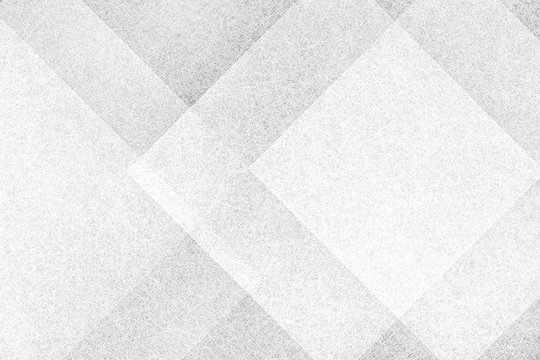 White abstract background pattern in creative modern triangle shapes and angles, white and gray textured block squares or diamond shape geometric pattern
