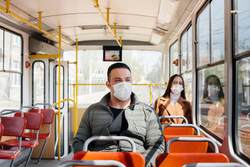 Passengers on public transport during the coronavirus pandemic keep their distance from each other....