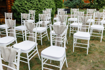 Decorative chairs at the summer wedding ceremony