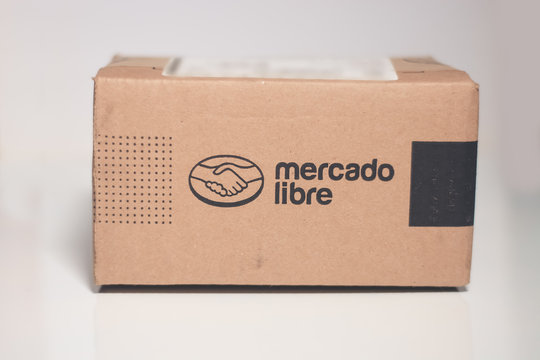 Monterrey, Mexico - March 28, 2019: Online store shipping box, standard mercadolibre package vertical view on isolated background