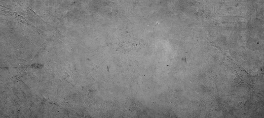 Grey or gray textured cement or concrete wall background