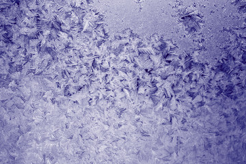 Fototapeta na wymiar Winter texture of frost on the glass window as a background.