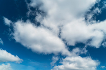 Light clouds in the blue sky during the day.