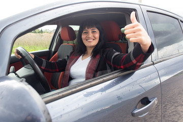 Naklejka premium Happy girl passed the car driving exam